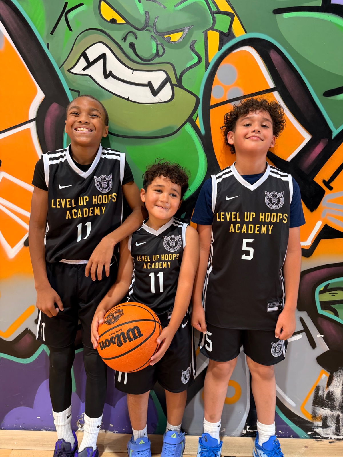 Young Level Up Hoops athletes #11, #11, #5